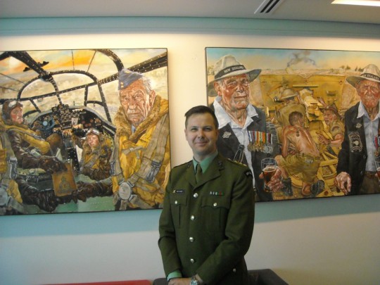 Matt Gauldie with two of his paintings